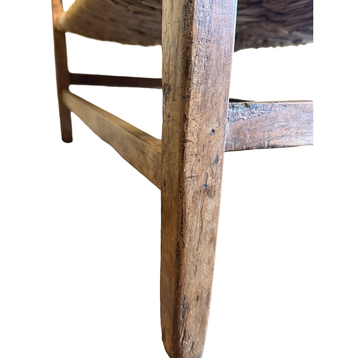 Aged walnut leg and stretcher showing period wear and traditional joinery on antique Arts & Crafts settee