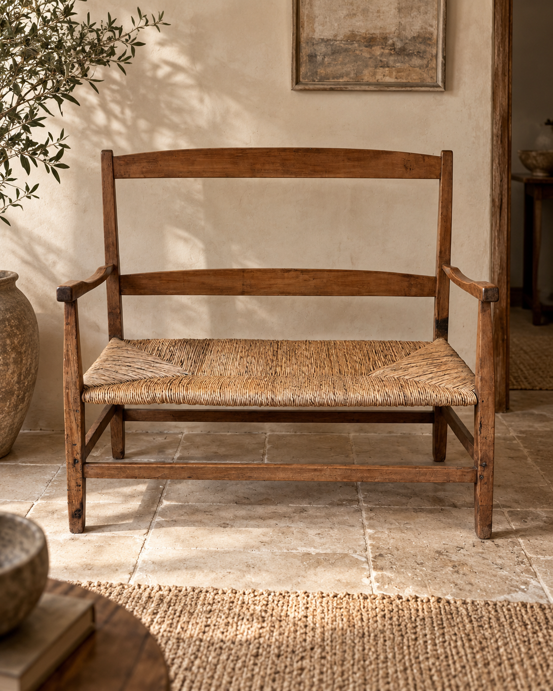 Antique c.1900 walnut and rush Arts & Crafts two-seater settee styled in a warm contemporary neutral interior