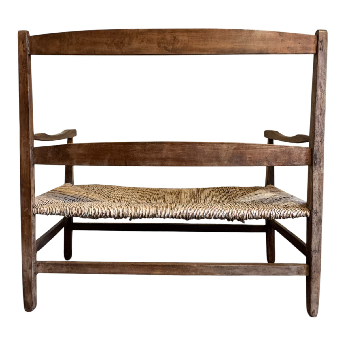 Rear view of antique English Arts & Crafts walnut two-seater settee showing broad back rails and traditional construction