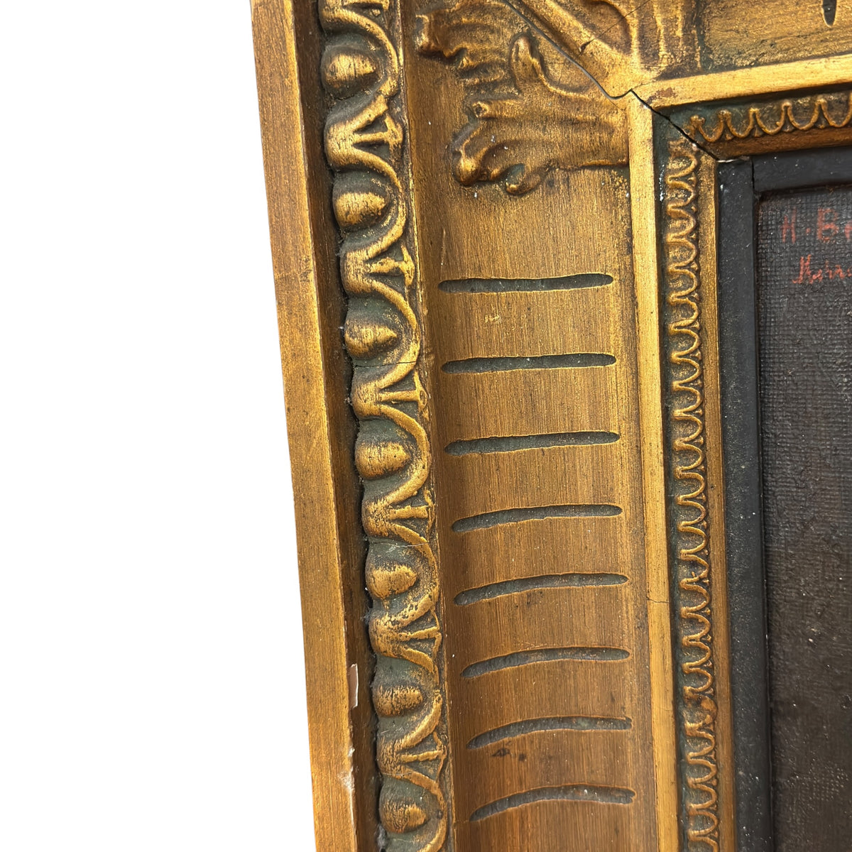 Detail of the frame’s upper left corner and side, showing aged gilding, decorative mouldings and part of the red signature
