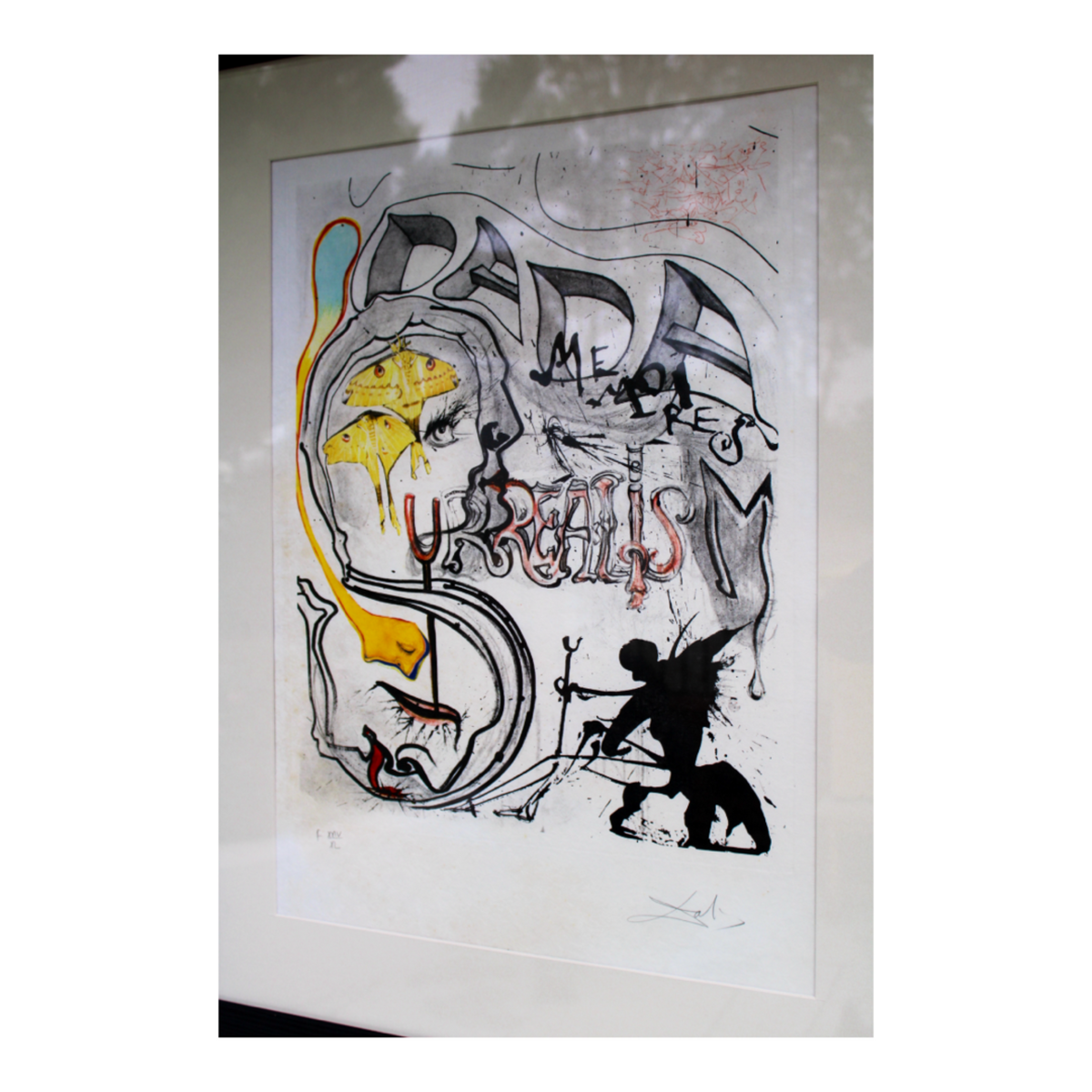 Angled left view of the framed original Salvador Dalí 'Angel of Dada Surrealism' limited edition lithograph showing the frame profile and presentation.
