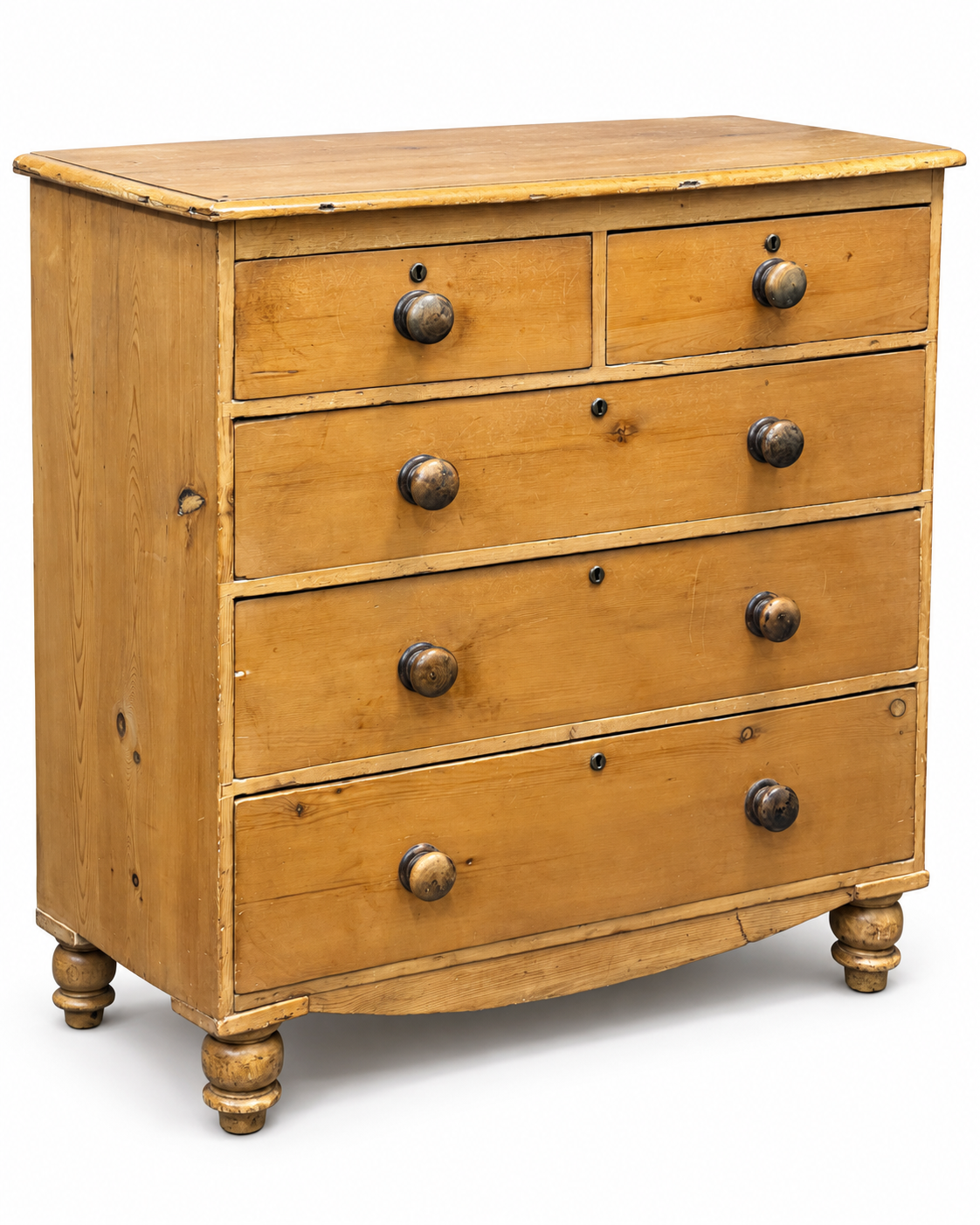 Three-quarter view of 19th century Victorian pine chest of drawers with original aged finish and five drawers.