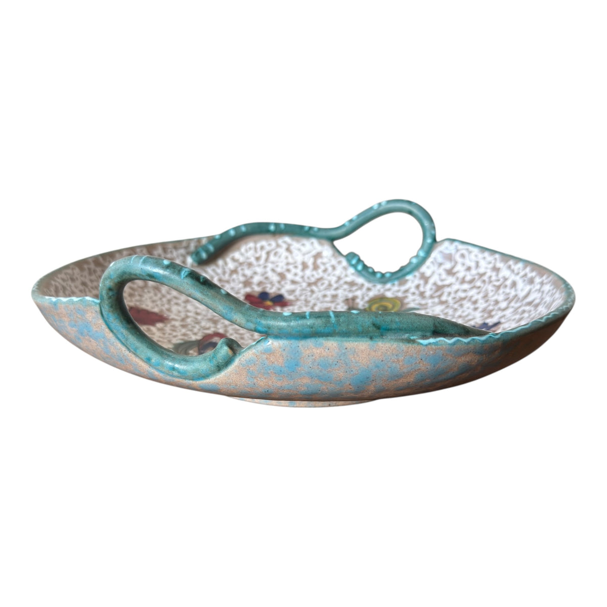 Side profile of 1950s ARS Artigiana Deruta bowl showing shallow form and sculptural turquoise loop handles