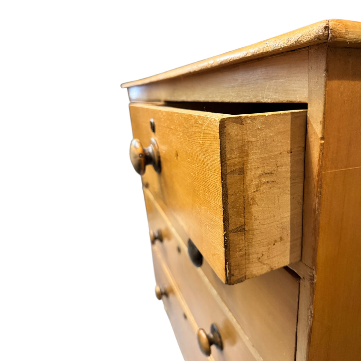 Side view of Victorian pine chest of drawers with drawers open, showing traditional drawer construction.