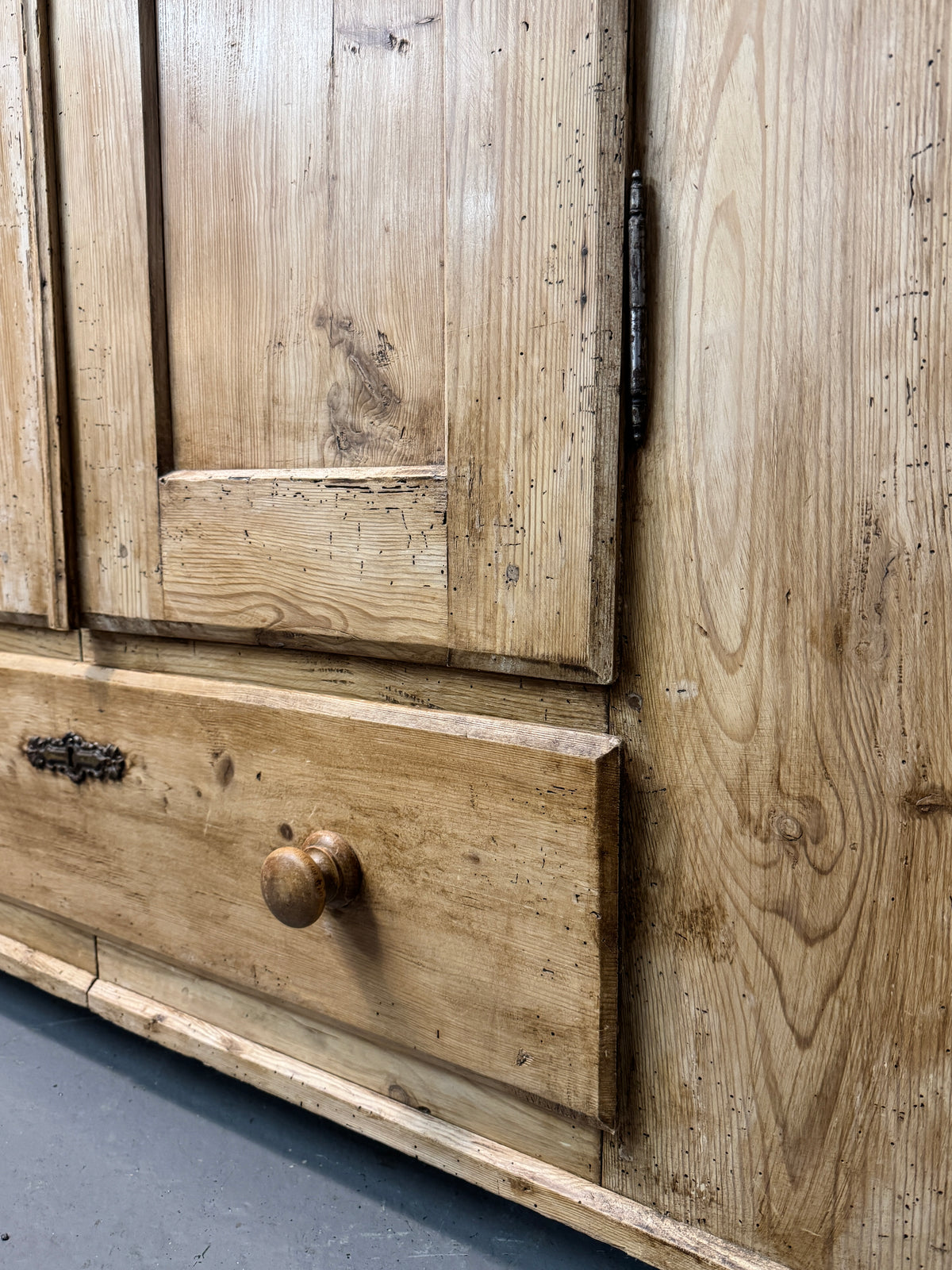 Antique Victorian pine wardrobe doors with decorative iron key escutcheon and characterful aged surface