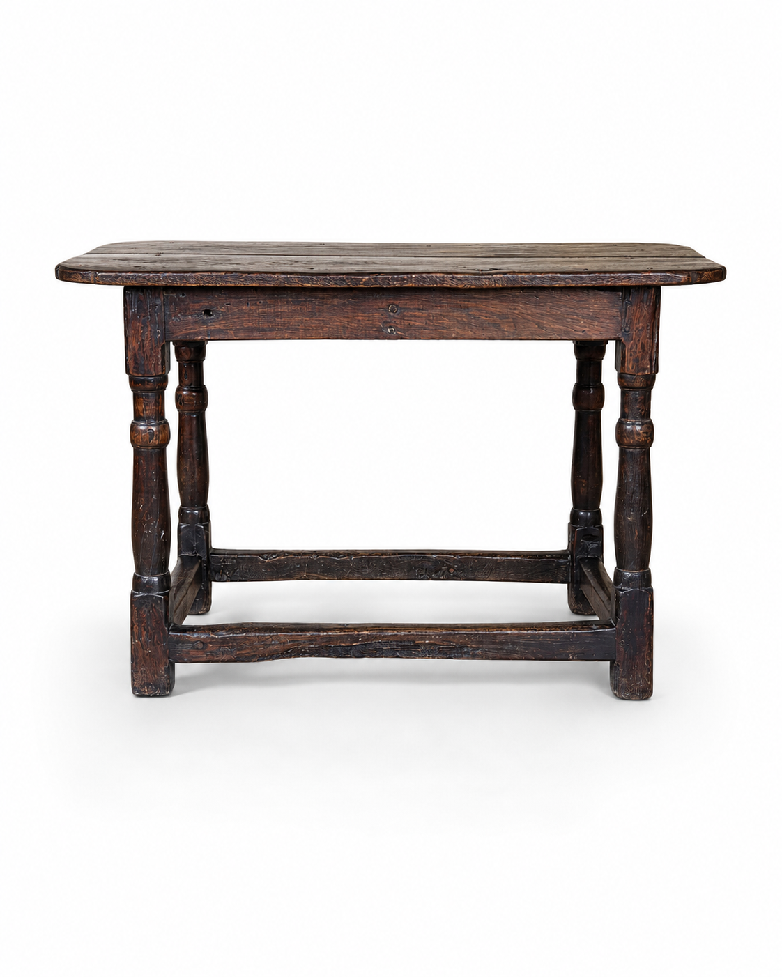 Late 17th century English oak tavern table with a two-plank top, turned legs and low box stretchers, shown against a plain white background.